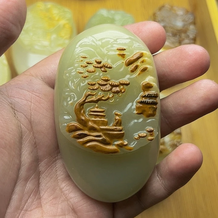 太*人石材方解石手把件