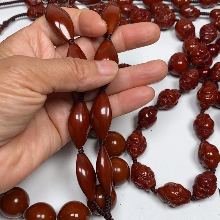 ****水橄榄核手持手串脖挂