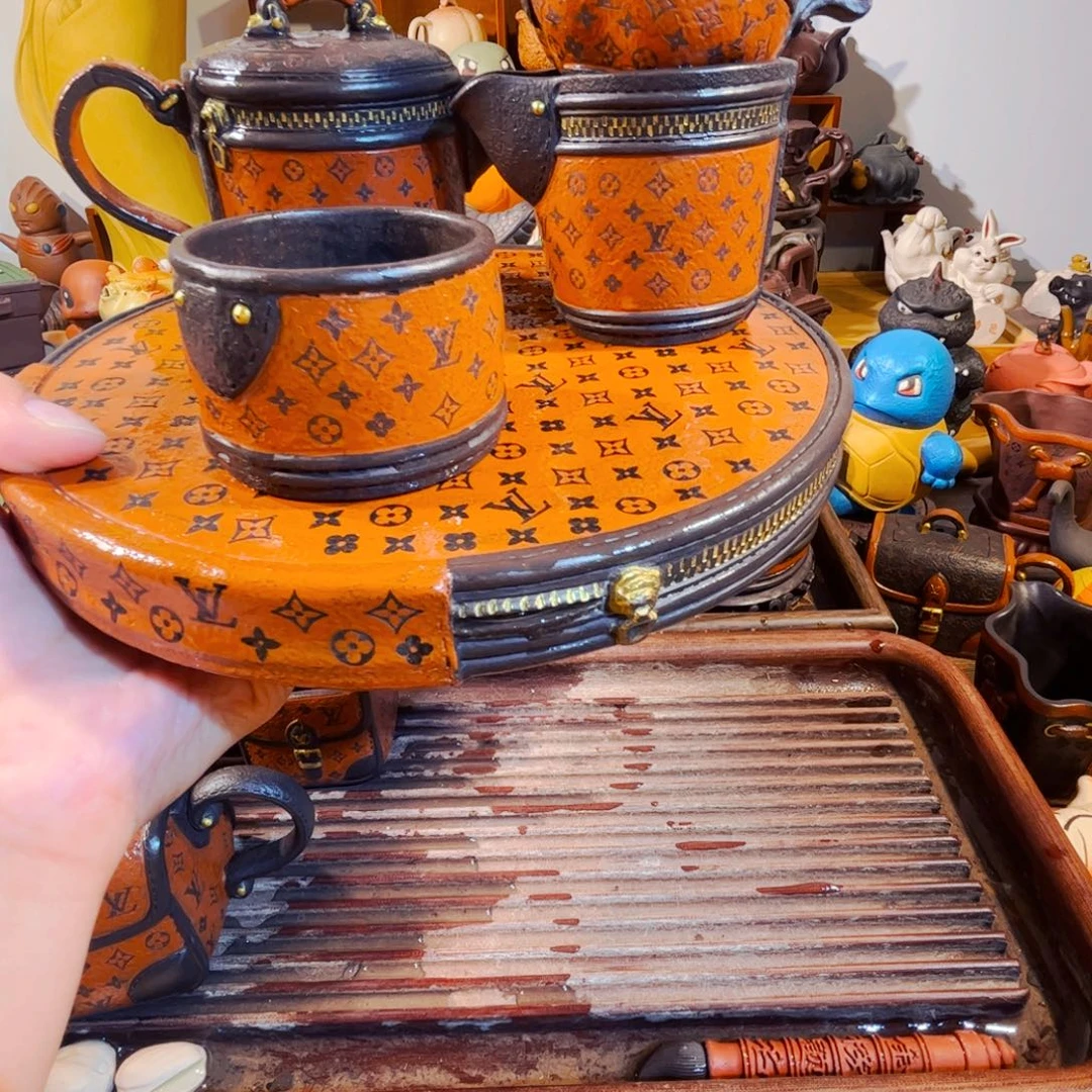 扬***邤茶壶紫砂纯手工制作的一家
