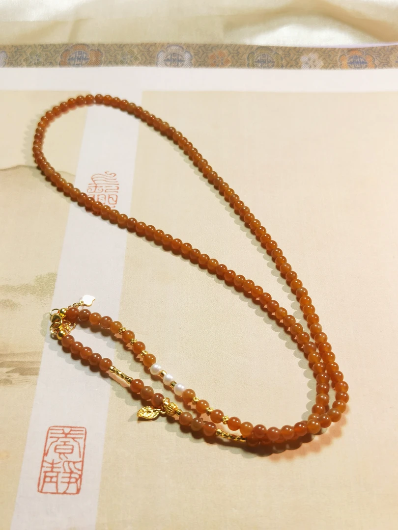 和田玉且末糖色小米珠串
