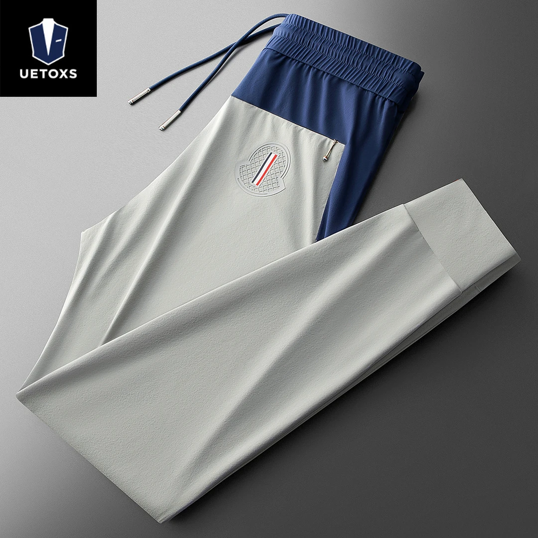 夏季时尚潮流撞色拼接冰丝抗皱速干休闲裤男士运动小脚牛奶丝卫裤