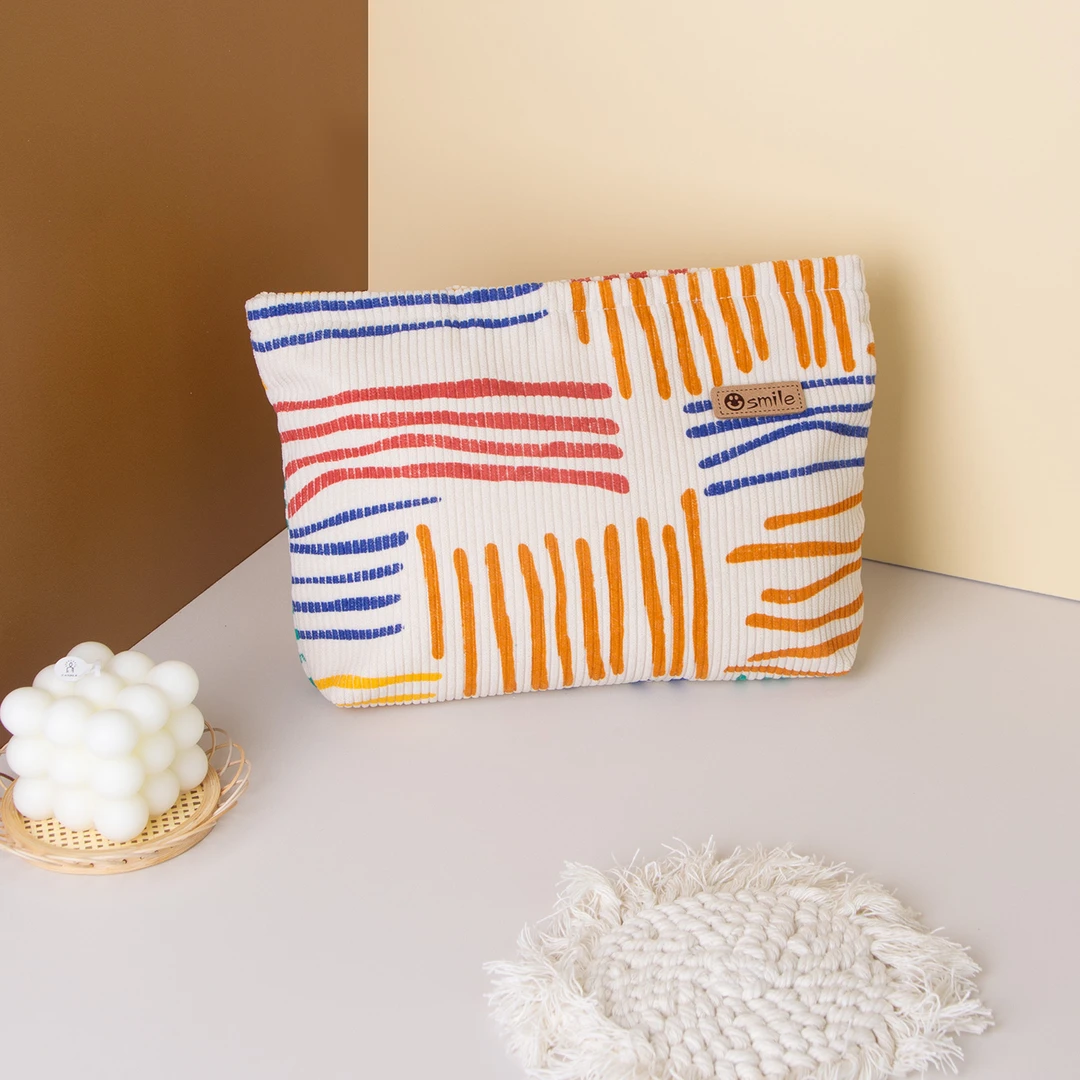 小众化妆包灯芯绒撞色条纹便携旅行出差收纳包护肤品收纳袋洗漱包