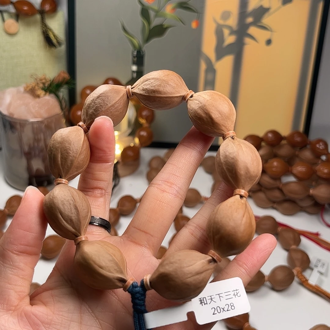 奥***卡橄榄核吊坠2028素串