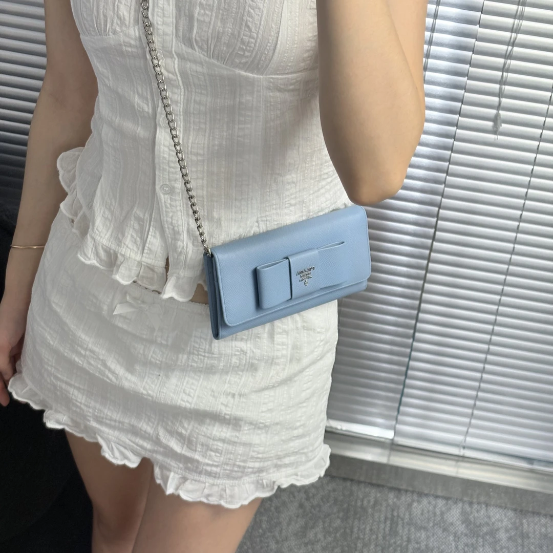 95新 Prada/普拉达 baby蓝蝴蝶结手拿包jx