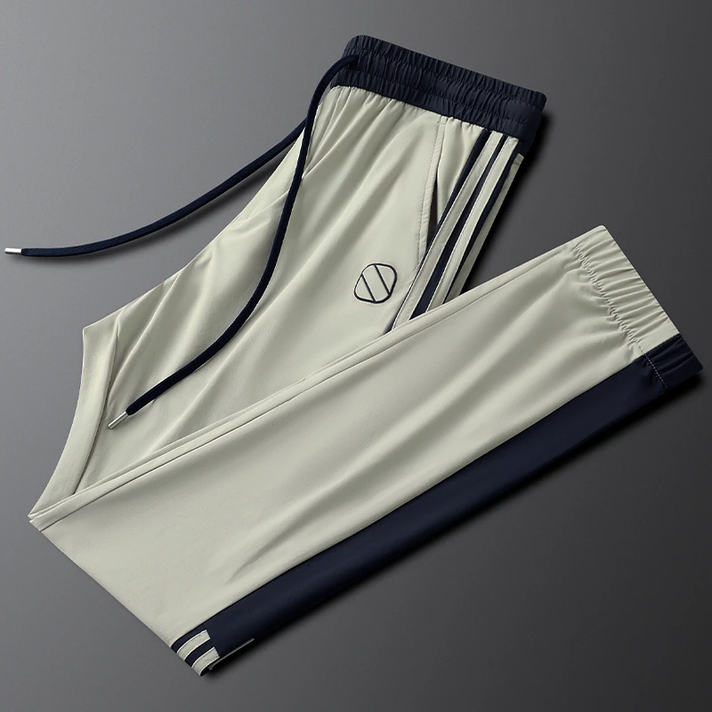 浅卡其色冰丝速干休闲运动裤男修身弹力夏季薄款侧条纹男士束脚裤