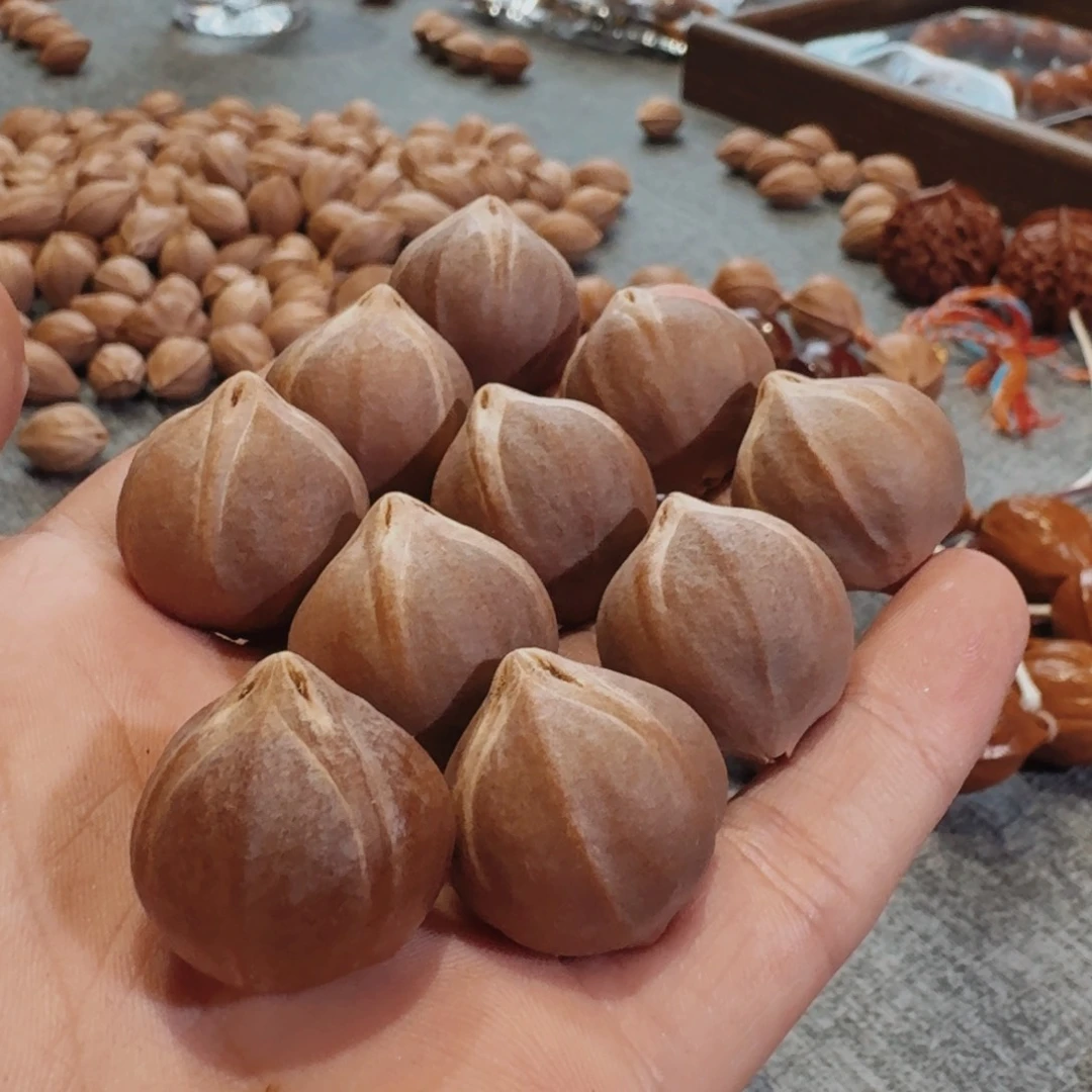 晚****橄榄核吊坠正四花