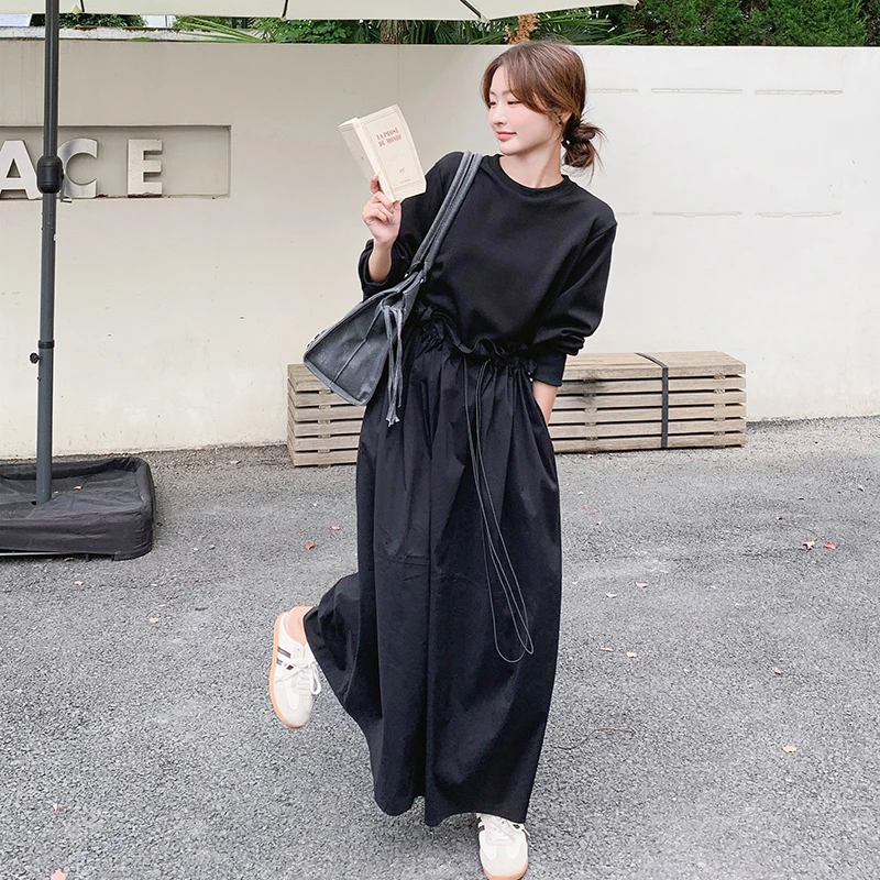 黑色赫本风拼接假两件卫衣裙女2025春季新款休闲高腰显瘦连衣裙子