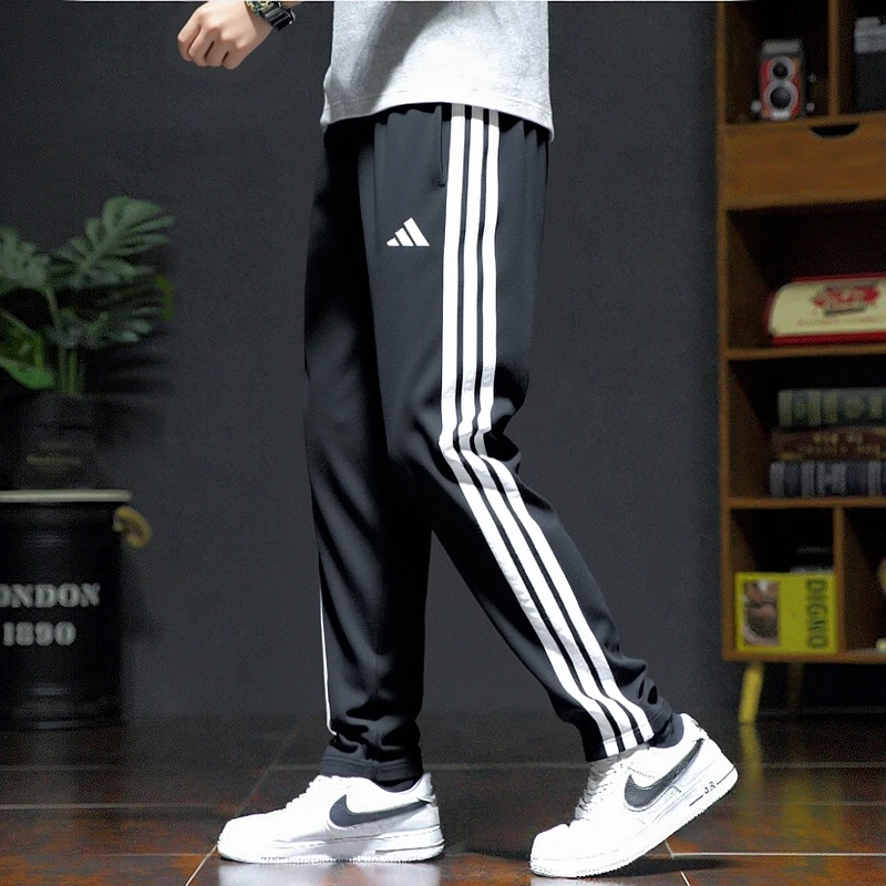 Adidas阿迪达斯男裤秋季运动长裤舒适休闲三条纹长裤流光风JE6430