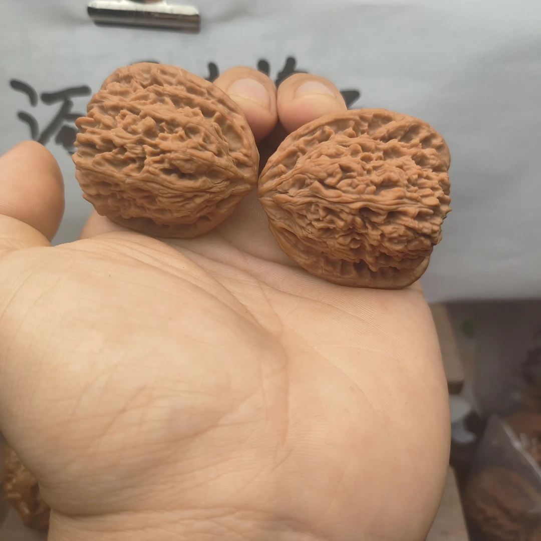 高炮凹底拉丝蚂蚁纹儿南疆石文玩核桃精品手把件
