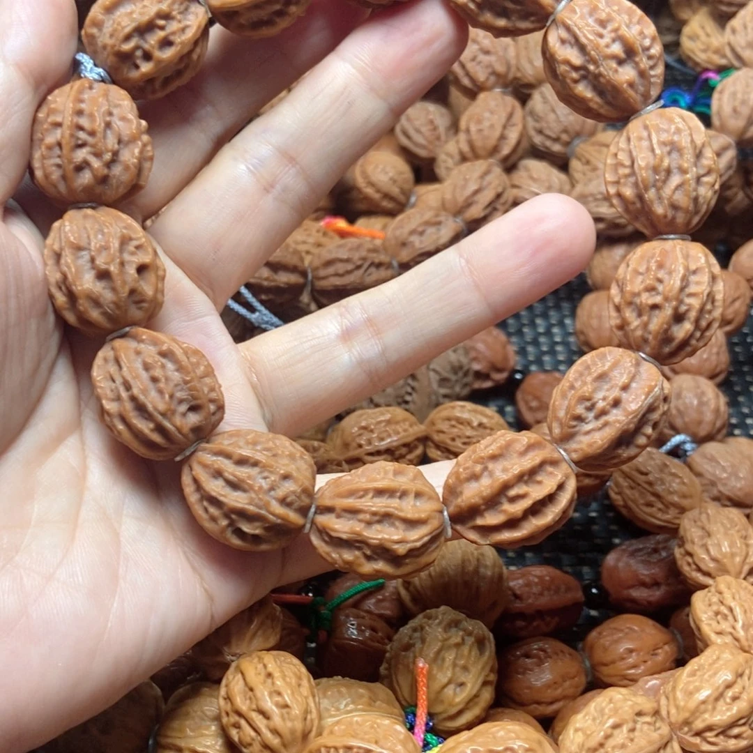 D***森桃核吊坠八棱手串