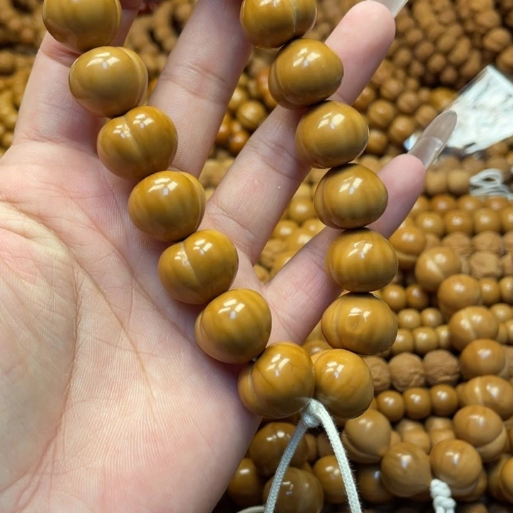 是***.核桃微瑕亮面屁桃手持