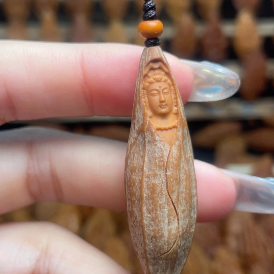 橄榄核把件包衣观音