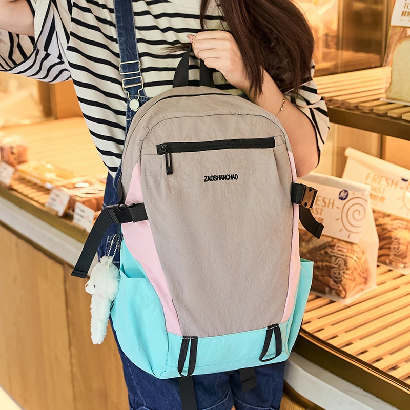 爬山双肩包简约撞色双肩包新款女大学生书包防水布轻便运动书包男