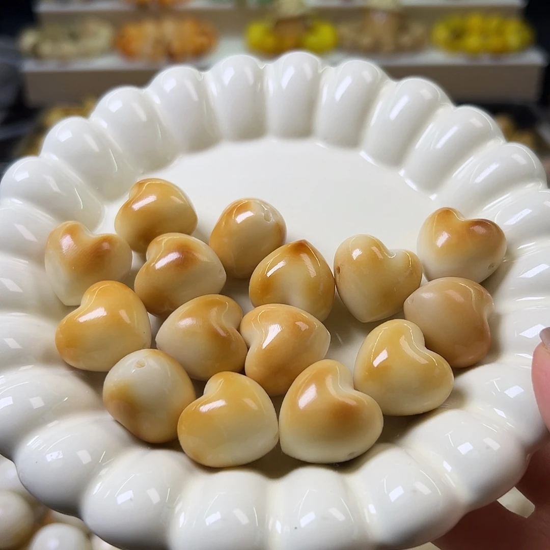 菩提根/象牙果手串瑕疵炭烤爱心10克