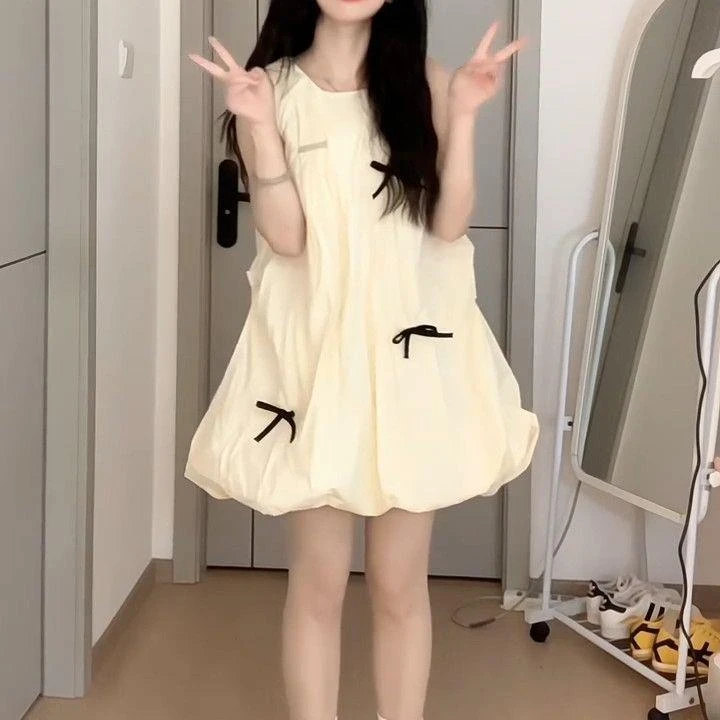 法式甜美无袖奶黄色蝴蝶结拼结背心花苞裙女夏季新款宽松遮肉短裙