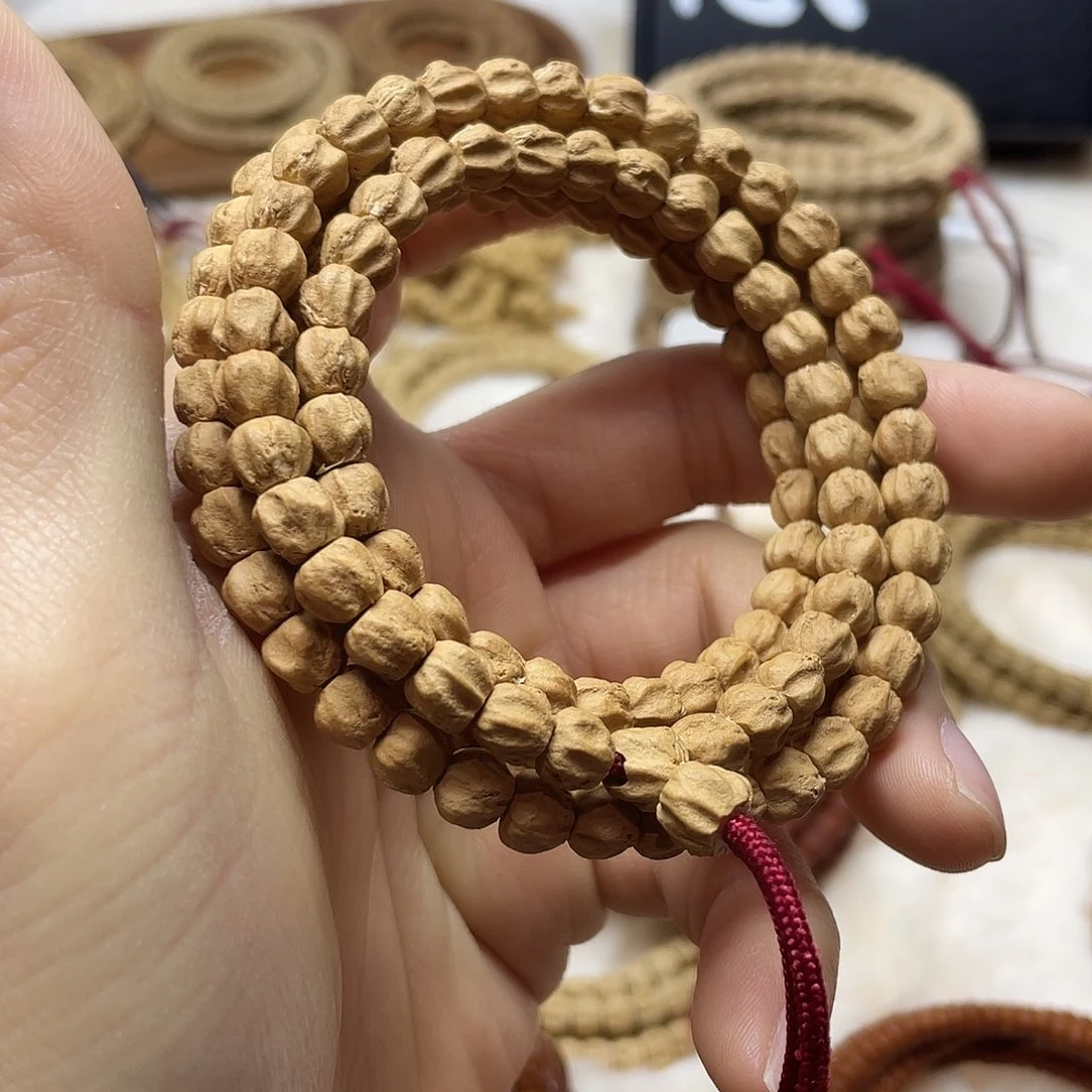 柏香籽/百香籽吊坠红皮微磨莲花龙脊7mm