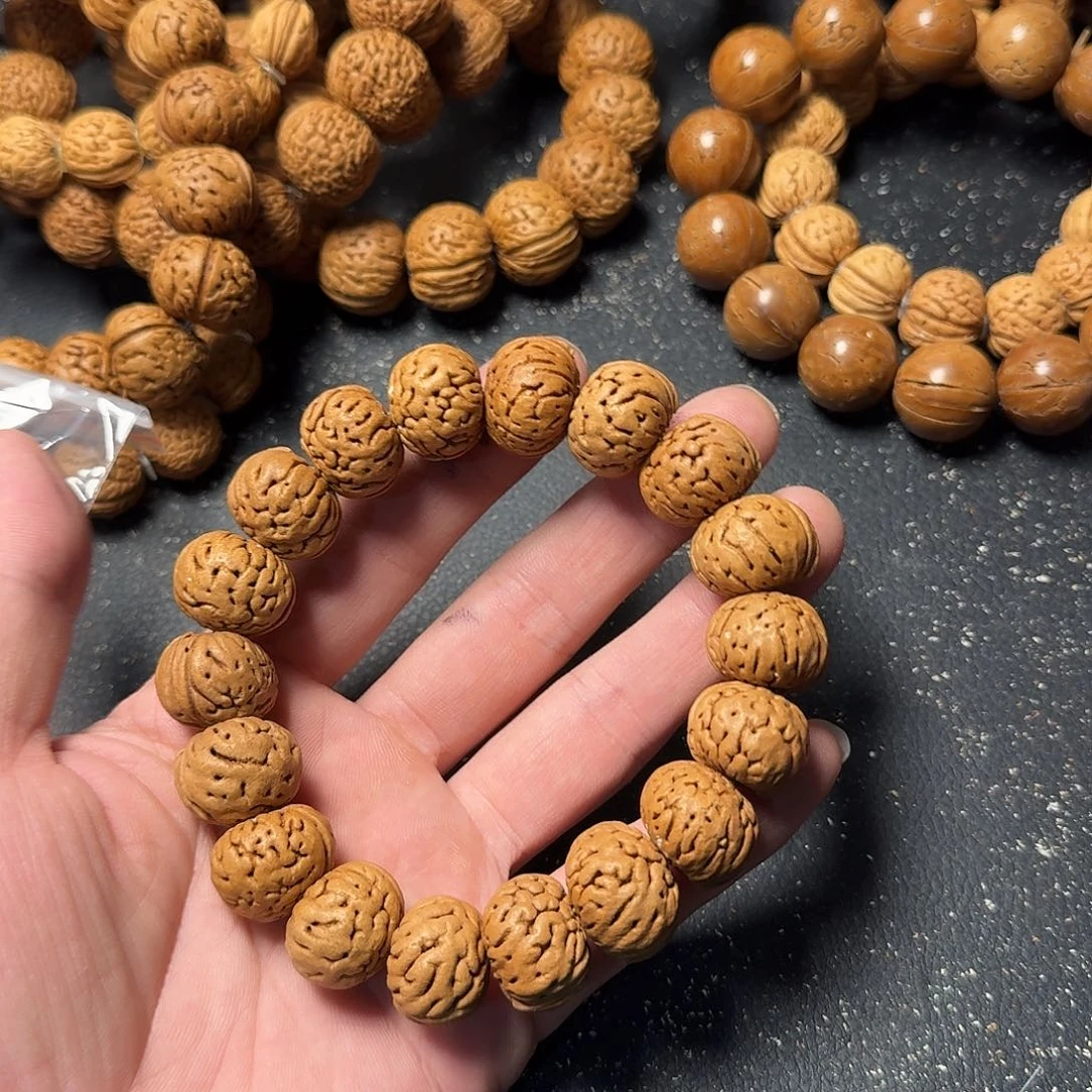 拳***开桃核吊坠纽扣手串