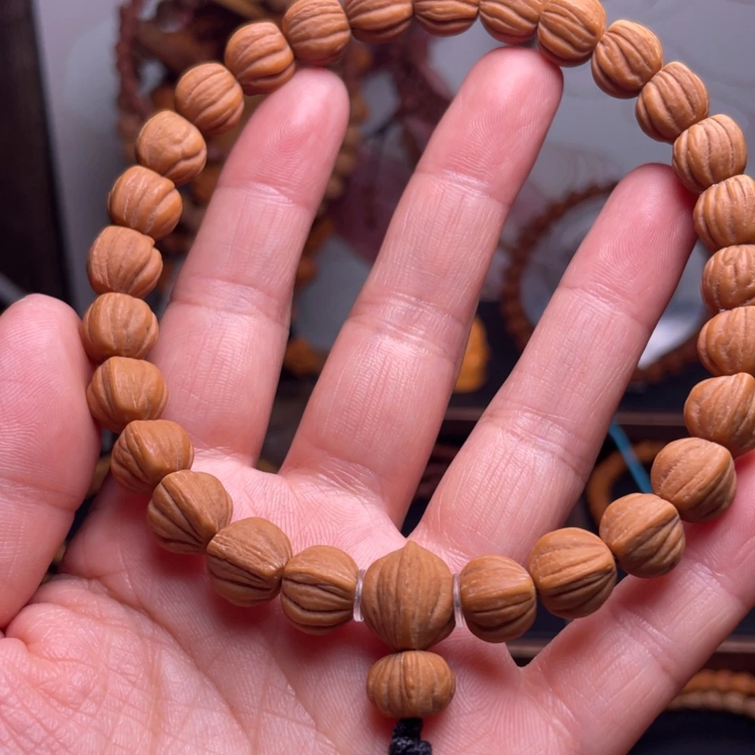 苏***明桃核吊坠龙文桃核