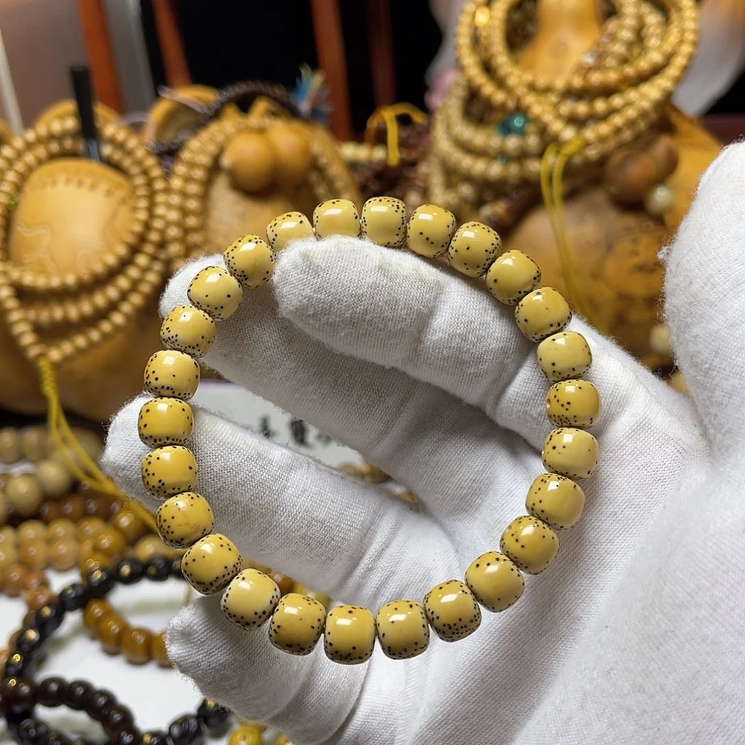 手串星月菩提8-9老型桶侧留白鸡油黄
