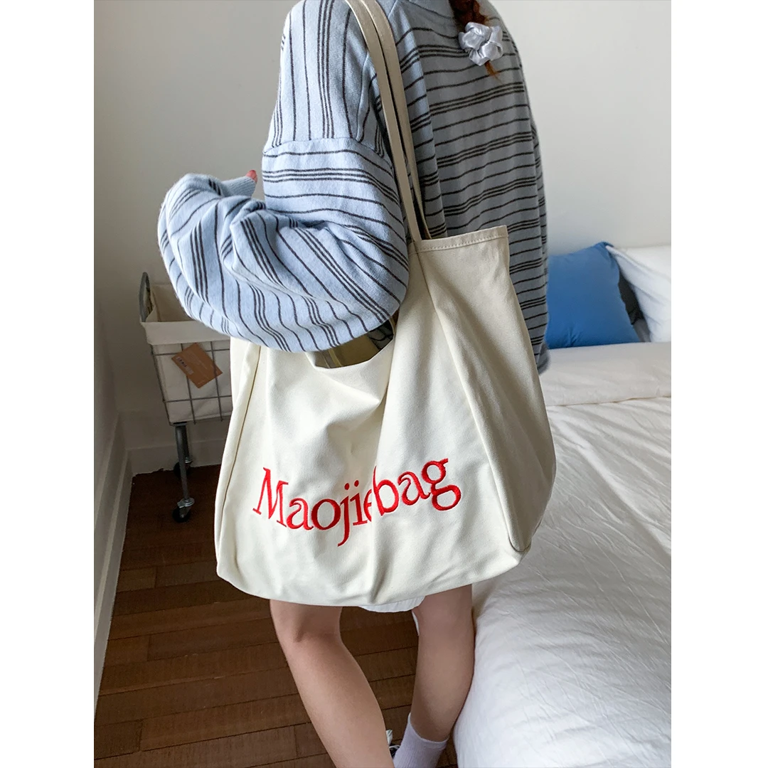 学院风字母帆布包包女2025新款潮时尚韩版托特包休闲大容量购物袋