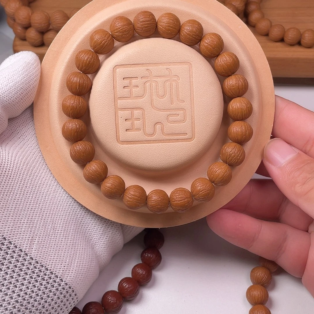 奇***。吊坠猴头核桃凤羽