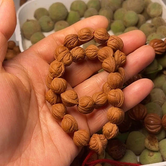 桃核吊坠?****?龙纹11小龙纹26颗手持加2颗10尺