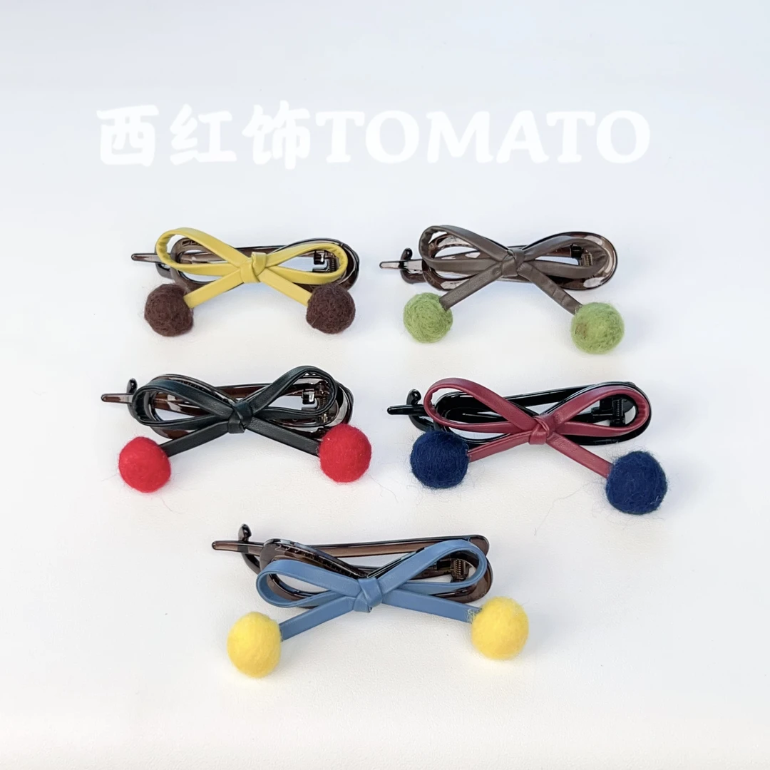 西红饰TOMATO韩国东大门百搭立体蝴蝶结球球八字扭扭夹