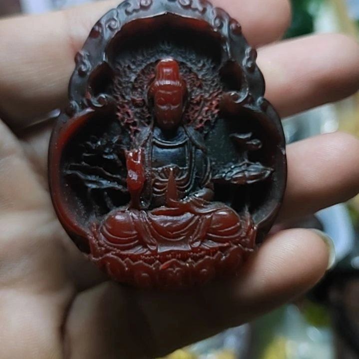 丁***当非金属坐观音手把件