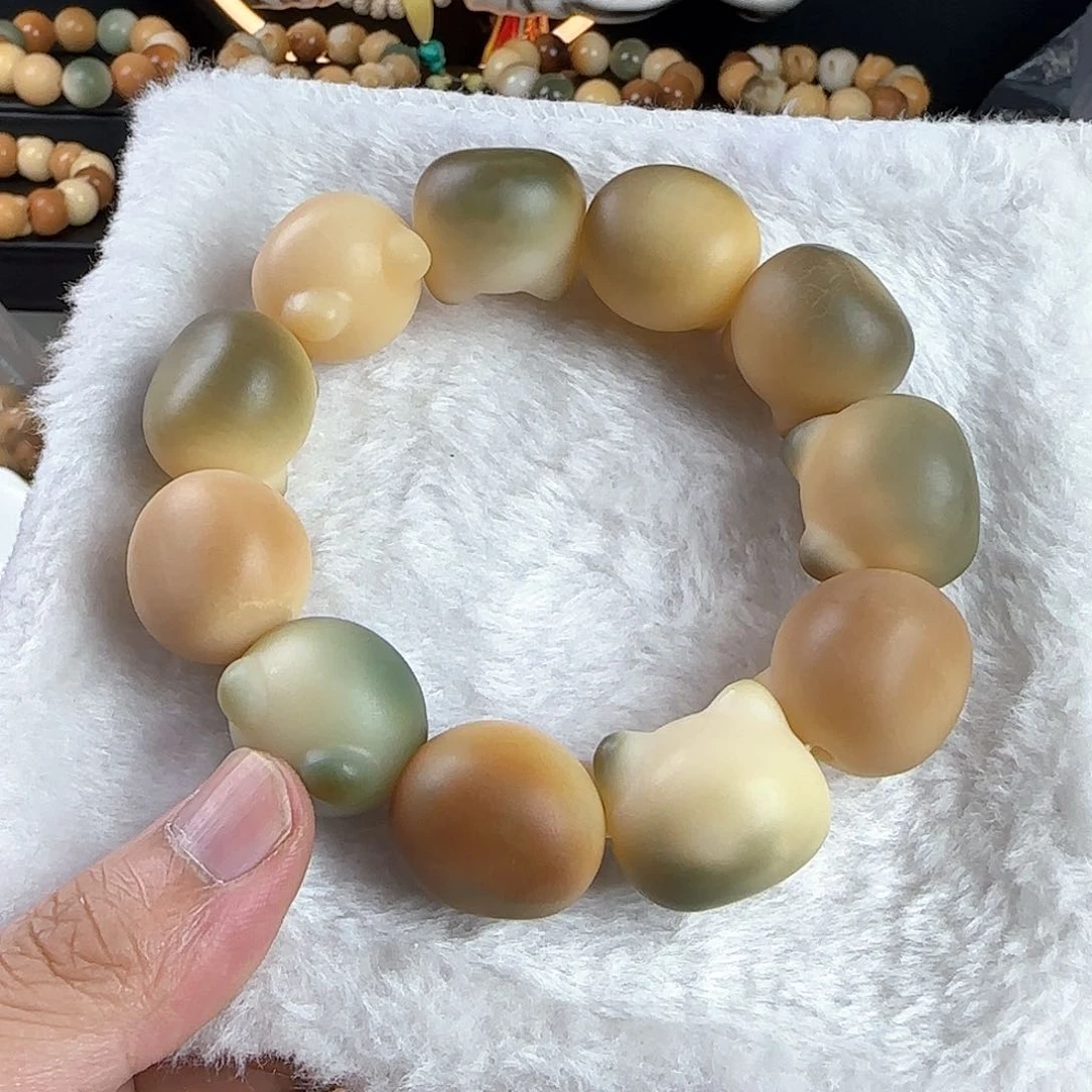 菩提根/象牙果吊坠姜****界瑕疵卡23猫头手串一条