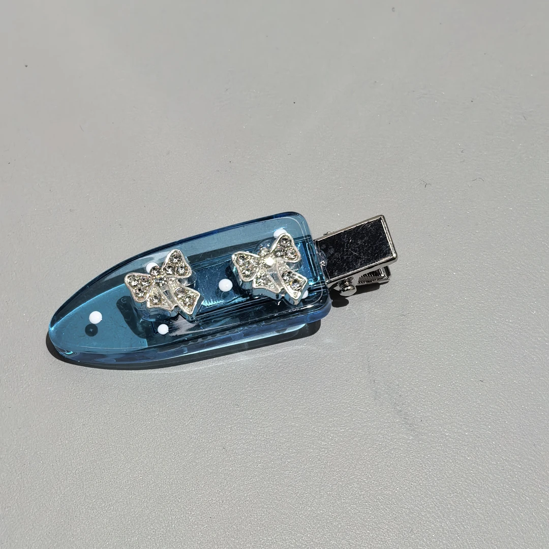 C089蓝色冰透小铲子闪闪蝴蝶结边夹