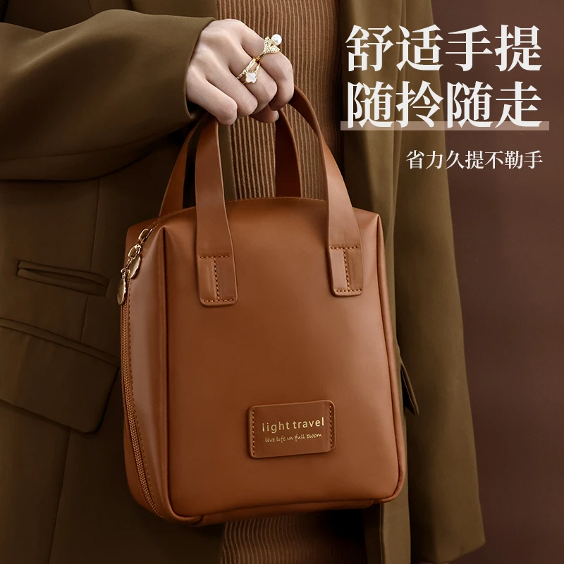 化妆包女2025新款便携式大容量高端手提袋盒护肤品收纳旅行洗漱包