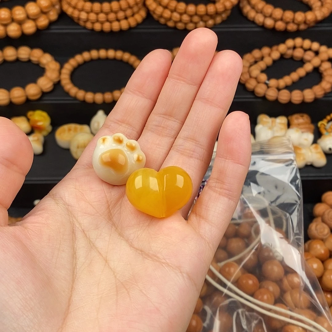 ໑****猴头核桃手串猫爪 爱心