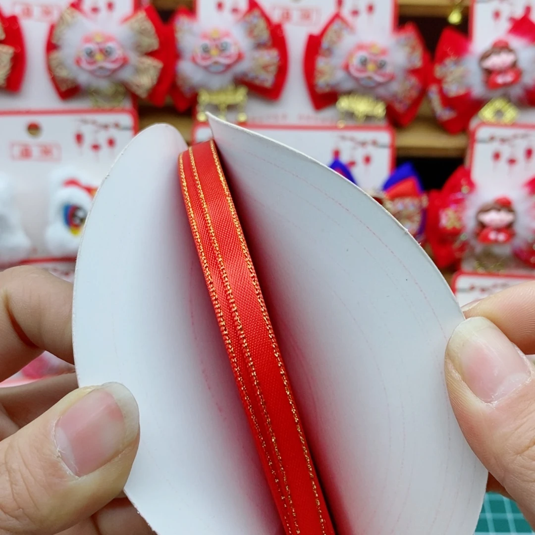 0.6金边涤纶带红色一卷50码