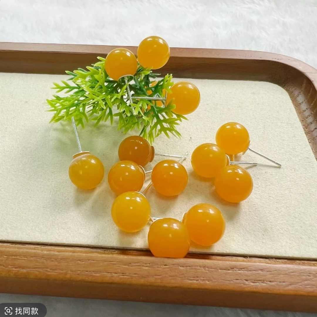 w003藏族精工打磨蜜糖红耳钉925