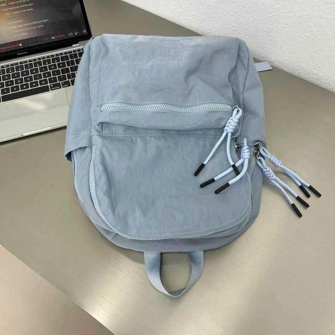 25春季新款大容量户外运动休闲双肩背包森系中大学生双肩背包