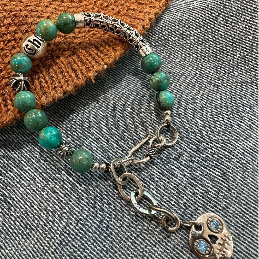 925银手链 S11182秋梦>绿珠镂空弯管克罗十字架珠蓝锆骷髅头手链