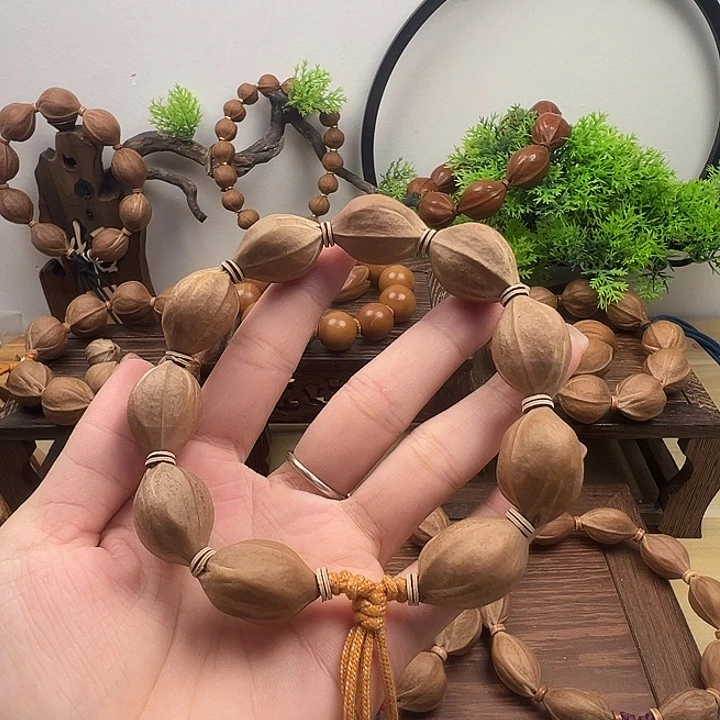 大***亮橄榄核手串18.25梅林铁核