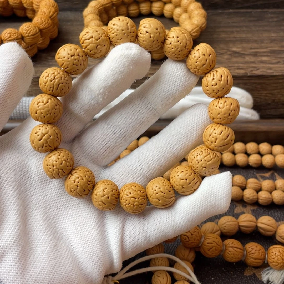 吊坠桃核明**辉金丹手串