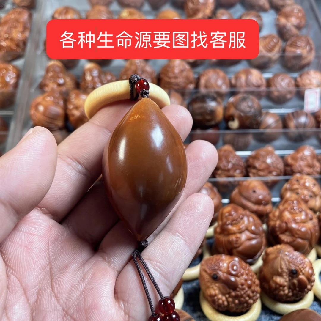 巴西橄榄核四面雕刻四大名器手把件