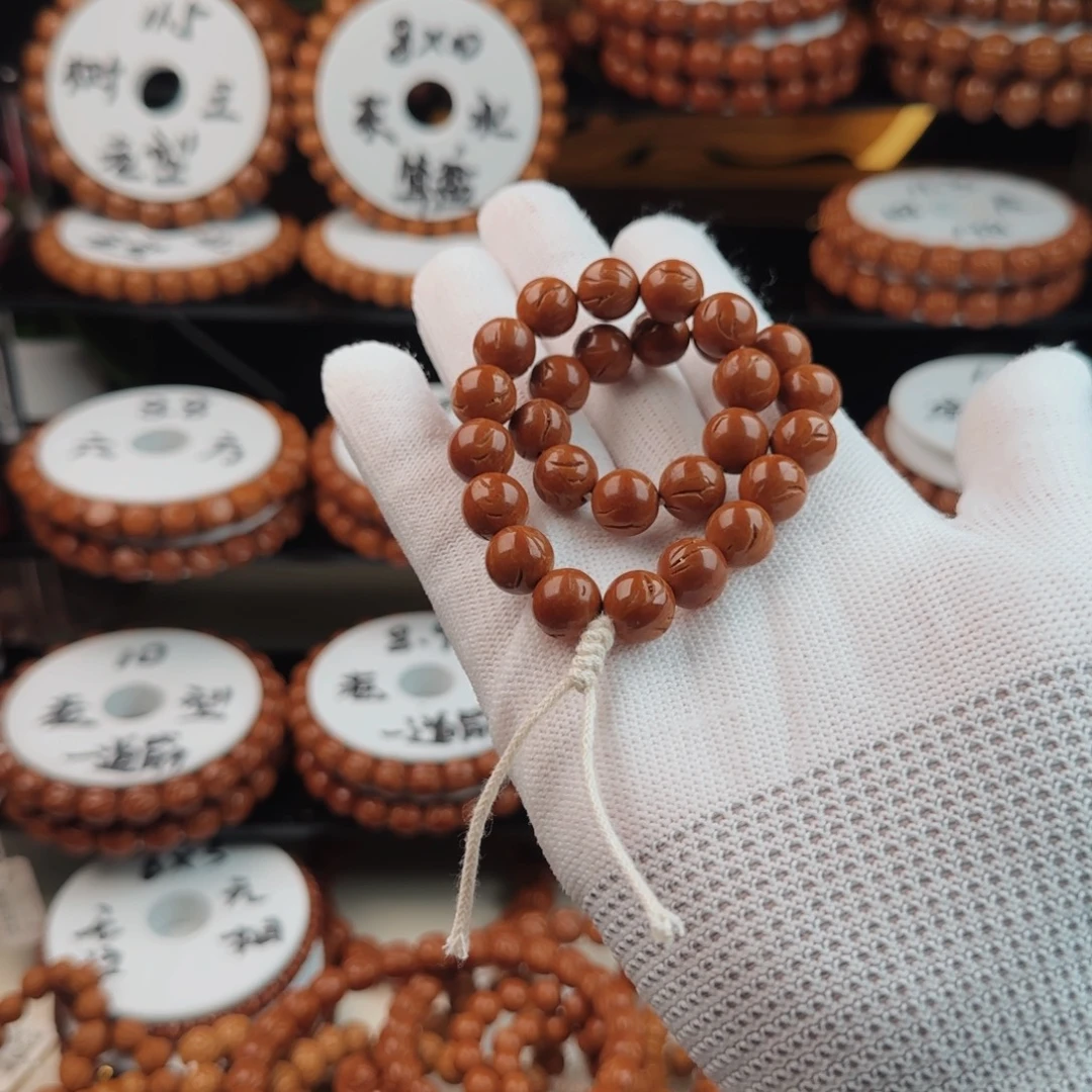 橘***s手串桃核龙纹桃核正圆光珠手持