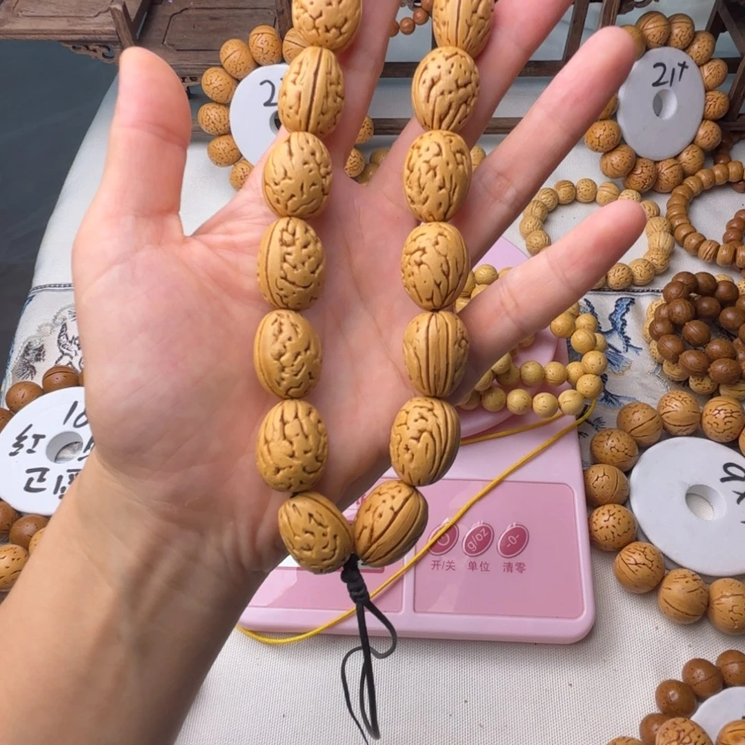 明**性东北脑纹桃核钱袋子手持