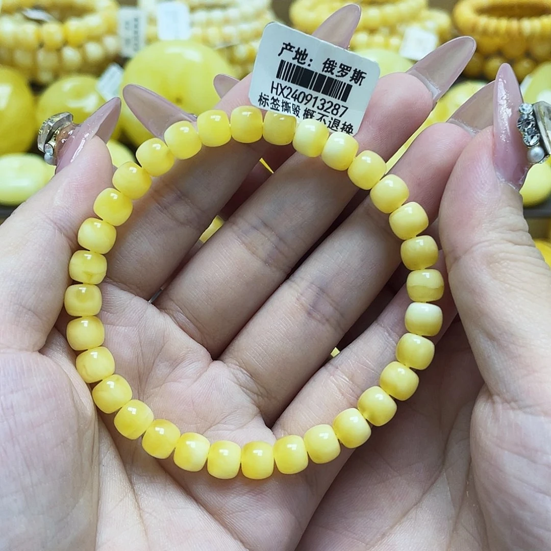 琥珀未镶嵌裸石6.7*5.6mm金白老型手串微瑕
