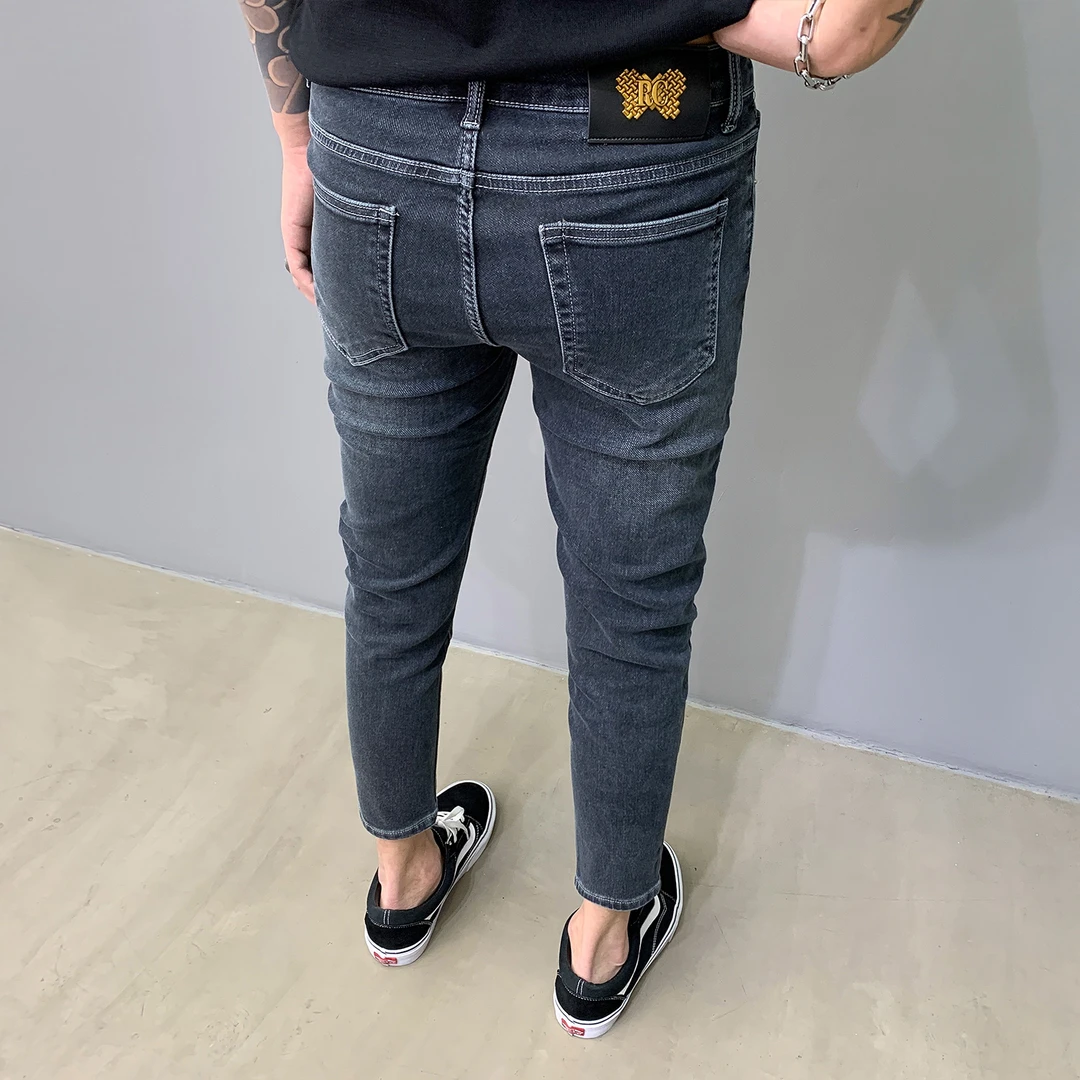 2025秋季复古蓝色九分牛仔裤男百搭做旧修身小脚裤潮流金属装饰