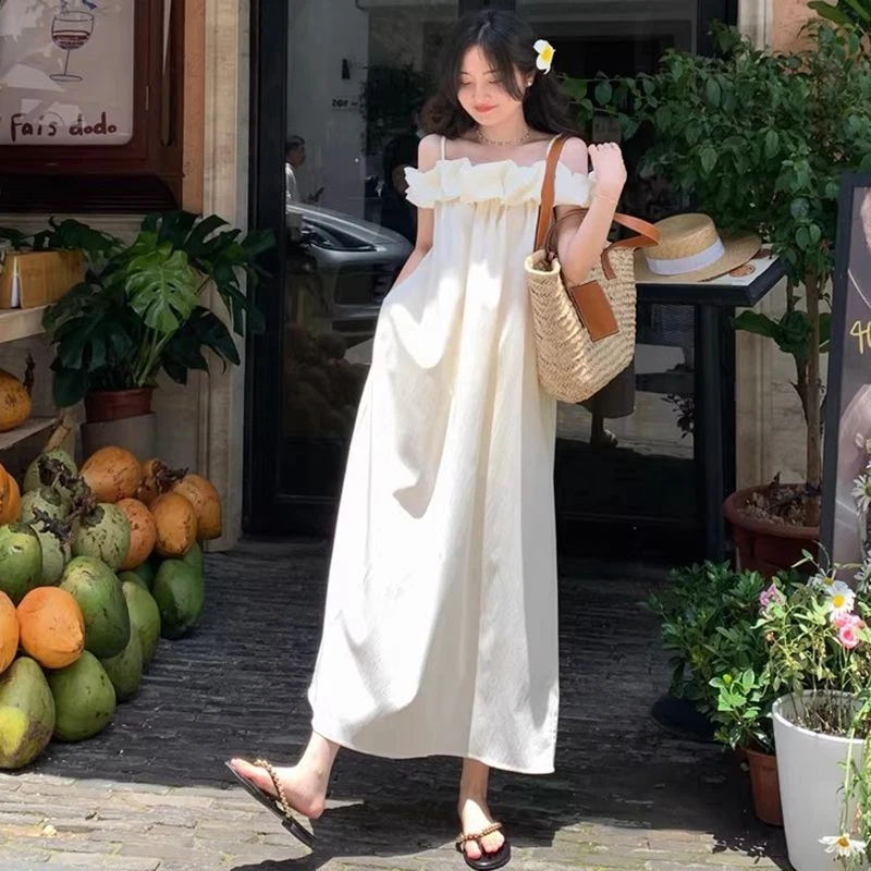 法式气质杏色一字肩吊带连衣裙女夏慵懒高级感露肩海边度假风长裙