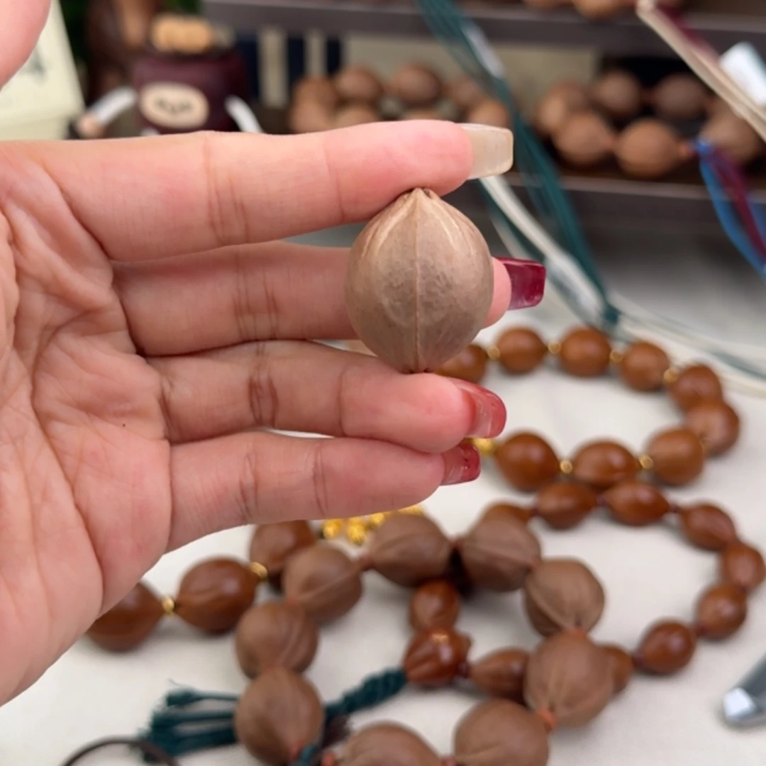 李****手串橄榄核2319四花三通