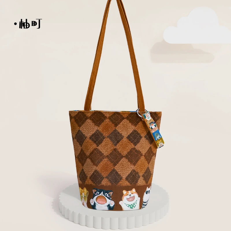 柚町x菱格橘猫卡通文艺大容量通勤水桶包个性简约帆布包女