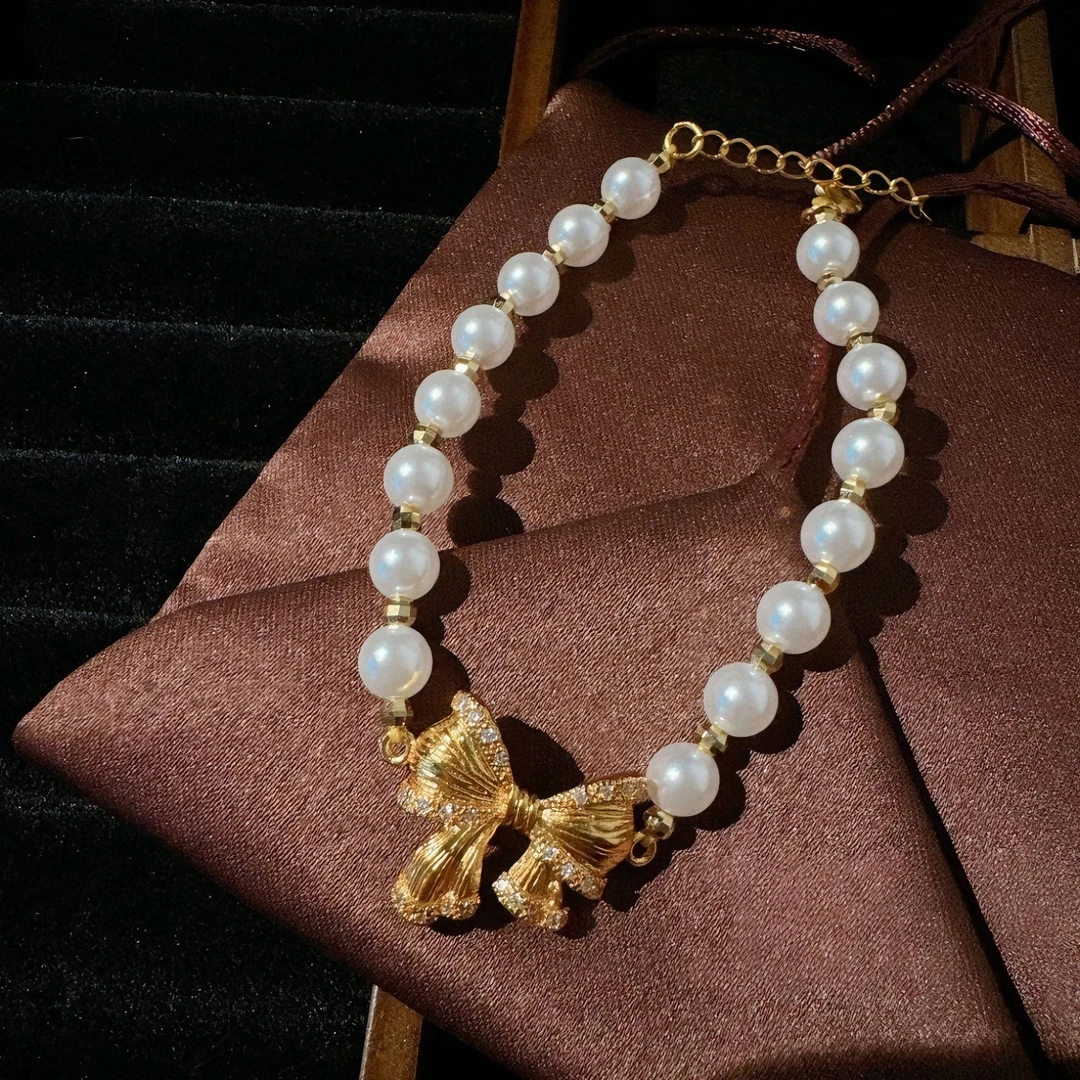 铜合金锆石手链 13073镀金蝴蝶结金色人工贝珠手链轻奢串珠小众