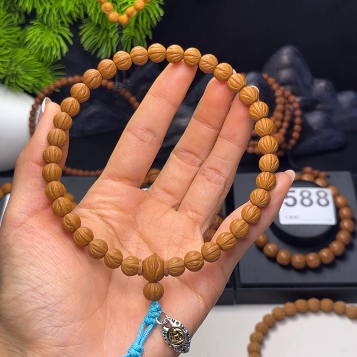 启***仁桃核吊坠玉龙脊0.8