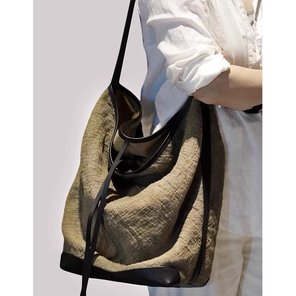 秋季新高级感大容量水桶包2025新款小众设计百搭通勤帆布单肩包女