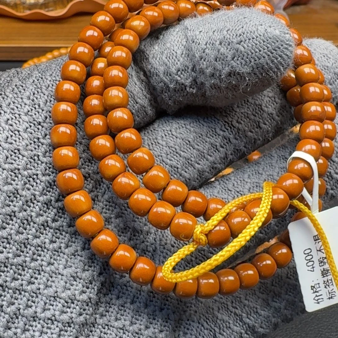 曾***。手串/手链橄榄核6.2老挝核尖108红料